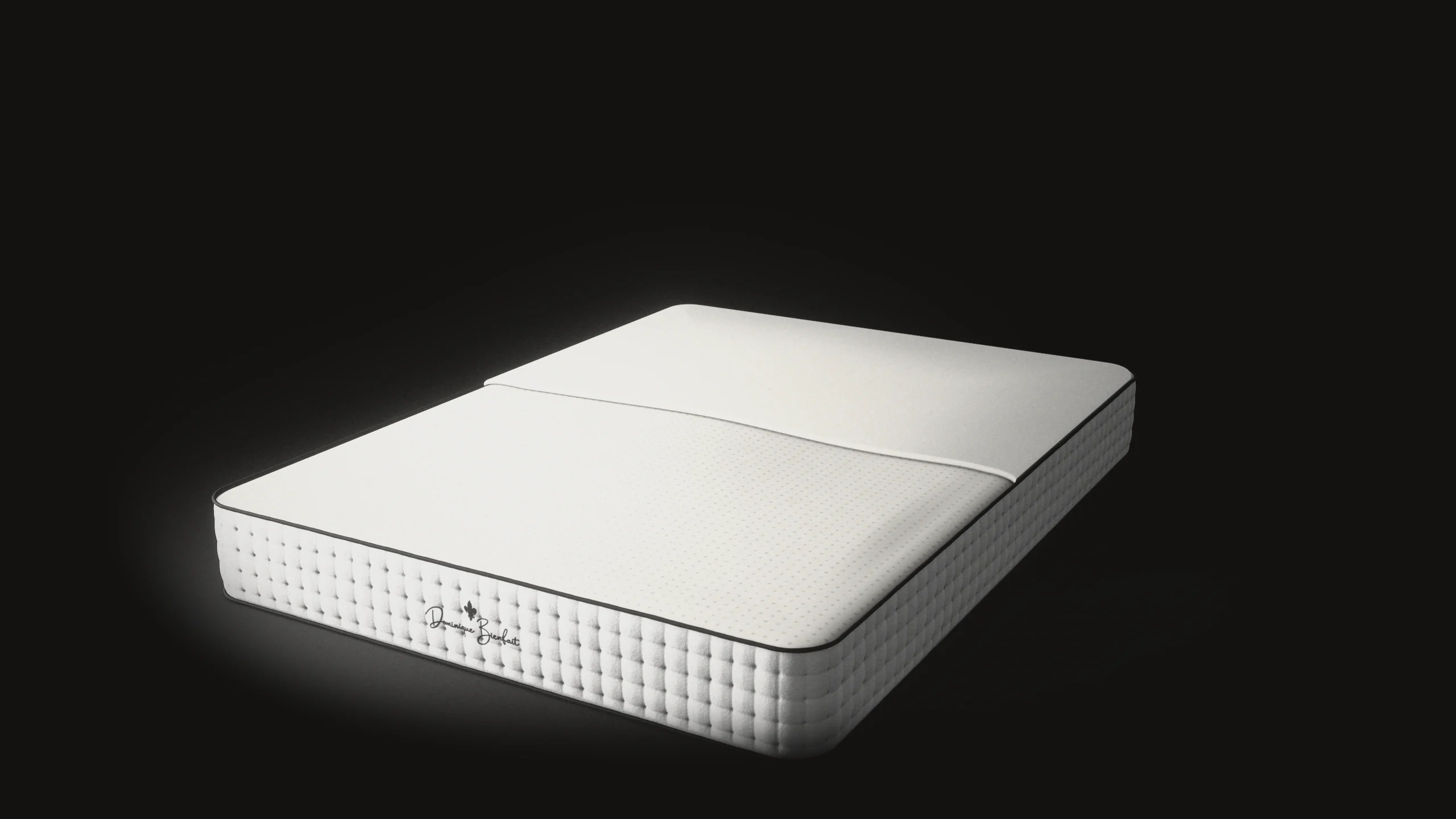 The top of the cover folded back to the middle of the mattress; the latex lies in its thin white inner cover, the pin holes showing through as soft grey dots, inside the tufted walls.