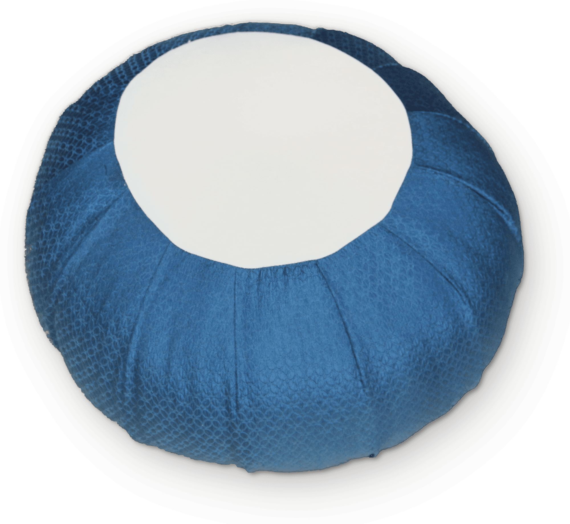 The zafu seen close: a round cushion with a pleated side and a flat round panel on top.